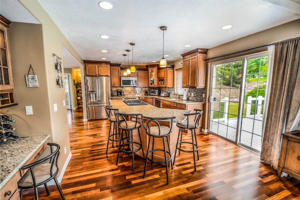 pexels-photo-534151 A luxurious modern kitchen featuring hardwood floors and granite countertops.